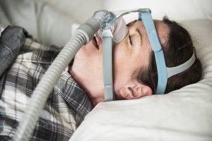 breathing device for treating sleep apnea